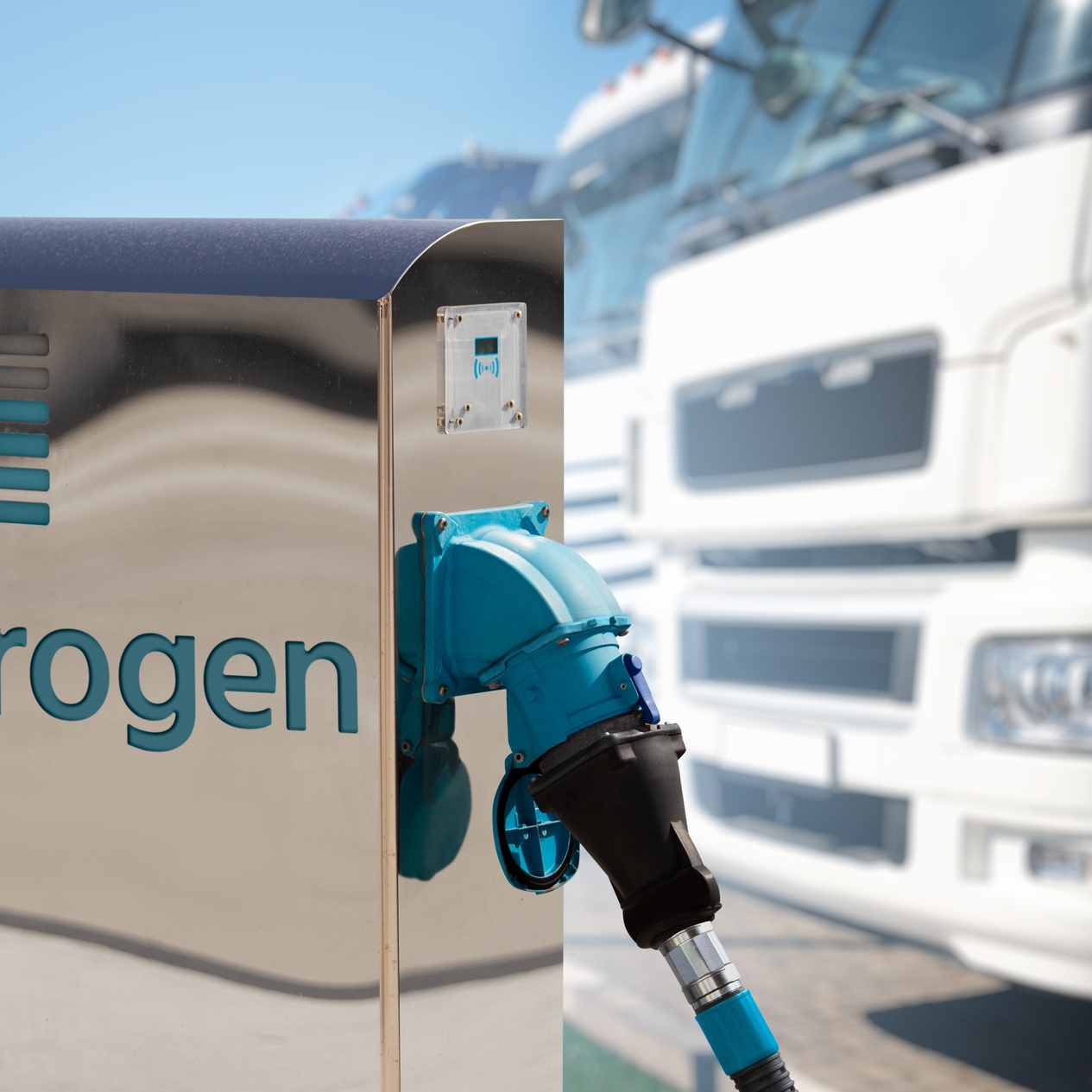 Self service hydrogen filling station on a background of trucks