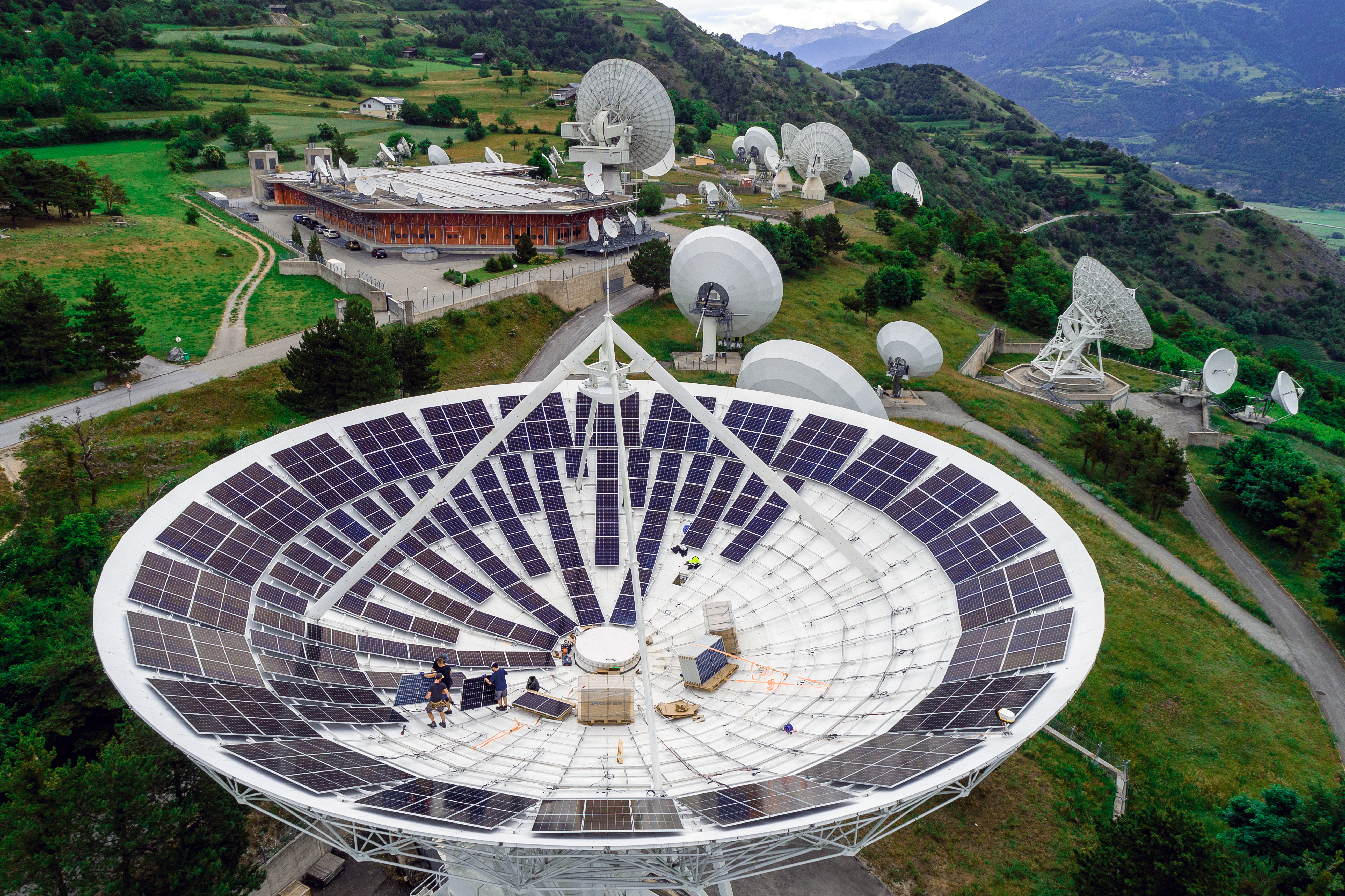 Axpo builds solar plants everywhere there are sensible locations, like hers in Leuk in a satellite dish