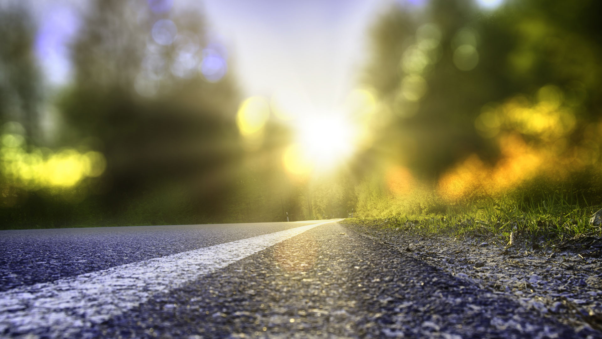 Street in backlight with bokeh, lensflares and sunbeams