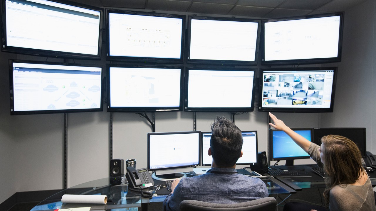 Business people working in control room